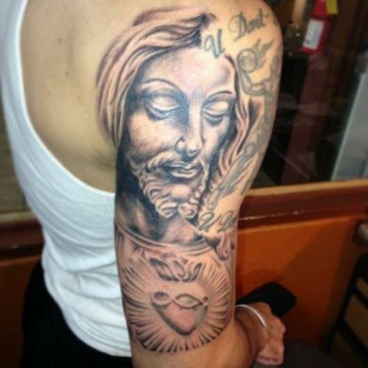 jesus statue tattoo