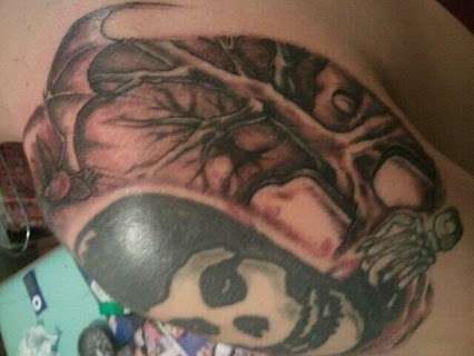 Misfits crimson ghost tattoo arm shaded ghoulish sceenery tattoo