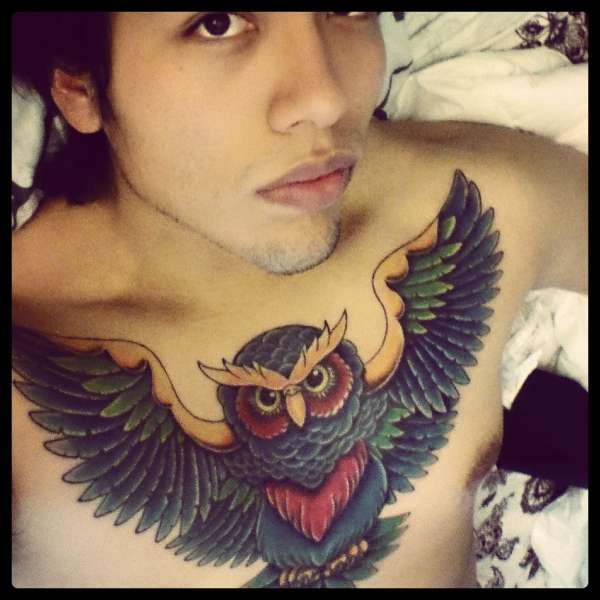 Owl chest piece tattoo