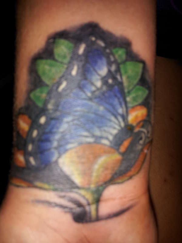 cover up of barcode with butterfly tattoo