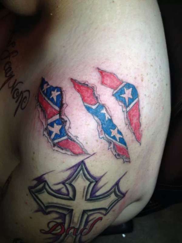 rebel flag tear in skin tattoo foy my southern heritage tattoo