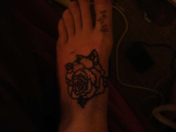 Rose on foot. tattoo