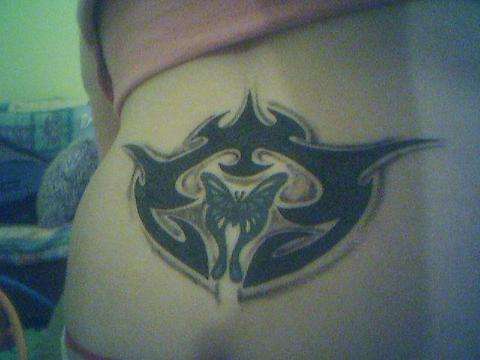 Butterfly and tribal tattoo