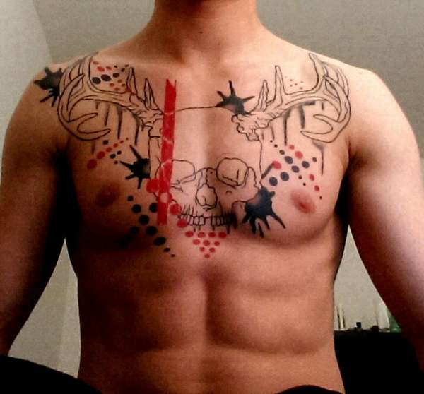 Black and red skull with antlers tattoo