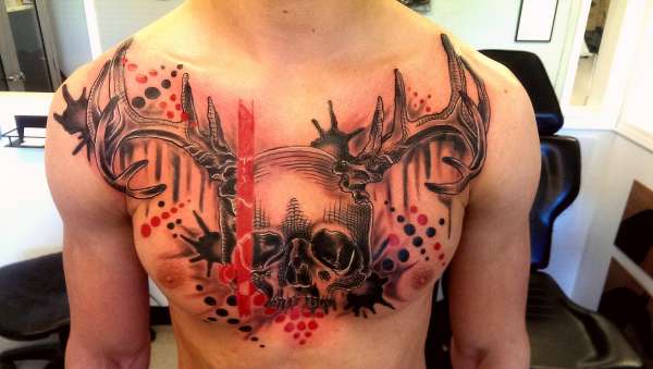 Black and red skull with antlers tattoo