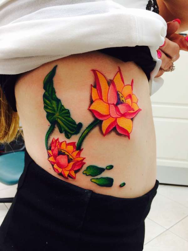 Lotus flower rib tattoo tattoo