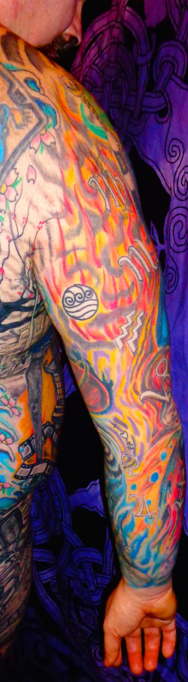 Right arm sleeve tattoo