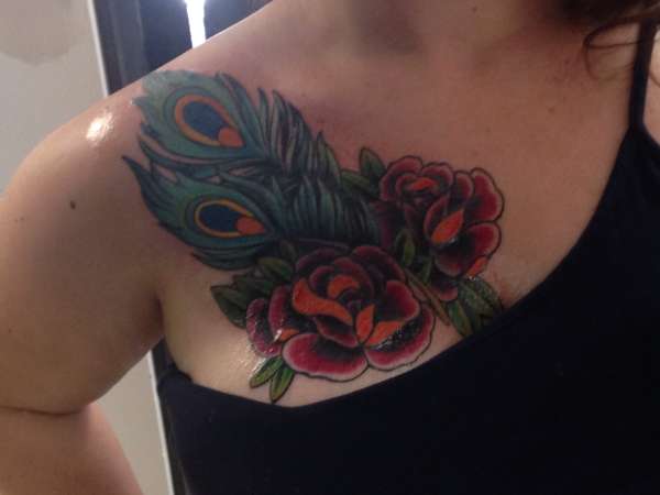 Roses and peacock feathers tattoo