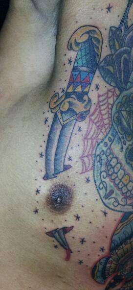 dagger through nipple tattoo