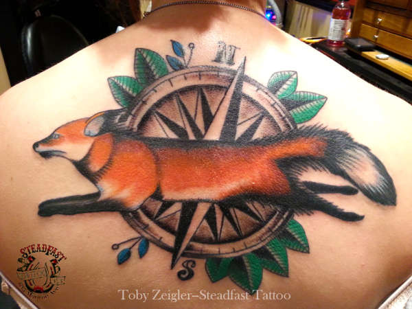 fox/compass back piece tattoo