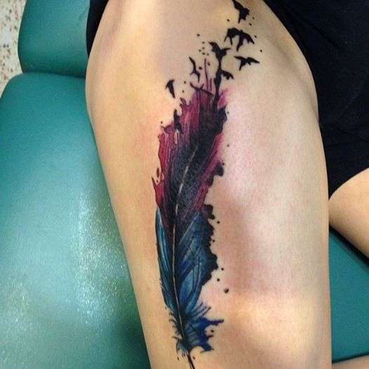 thigh feather tattoo