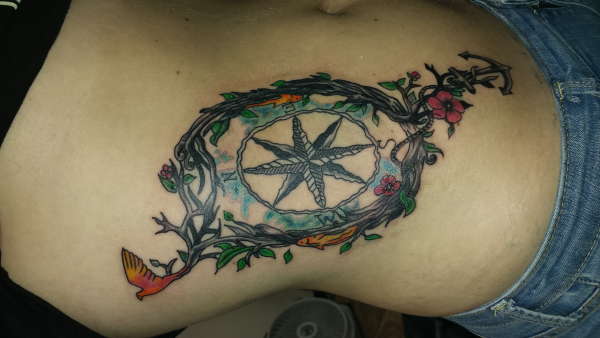 Compass and tree tattoo