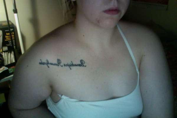 In Polish "hopeless romantic" tattoo