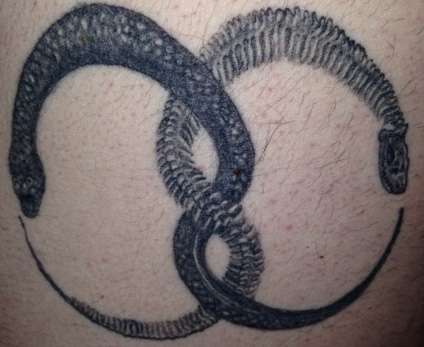 Oroborous tattoo