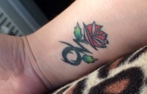 Capricorn symbol/rose tattoo