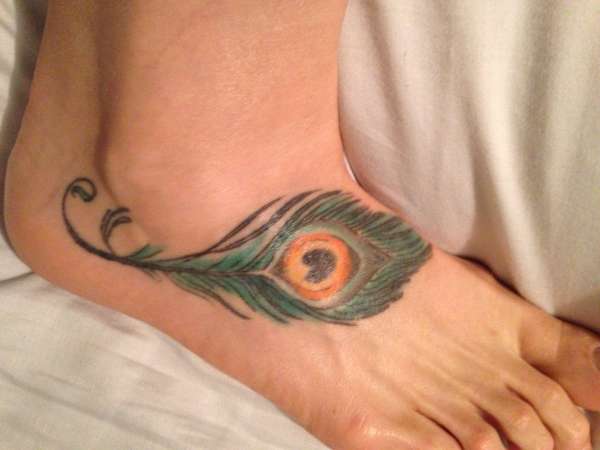 Peacock feather on my foot tattoo