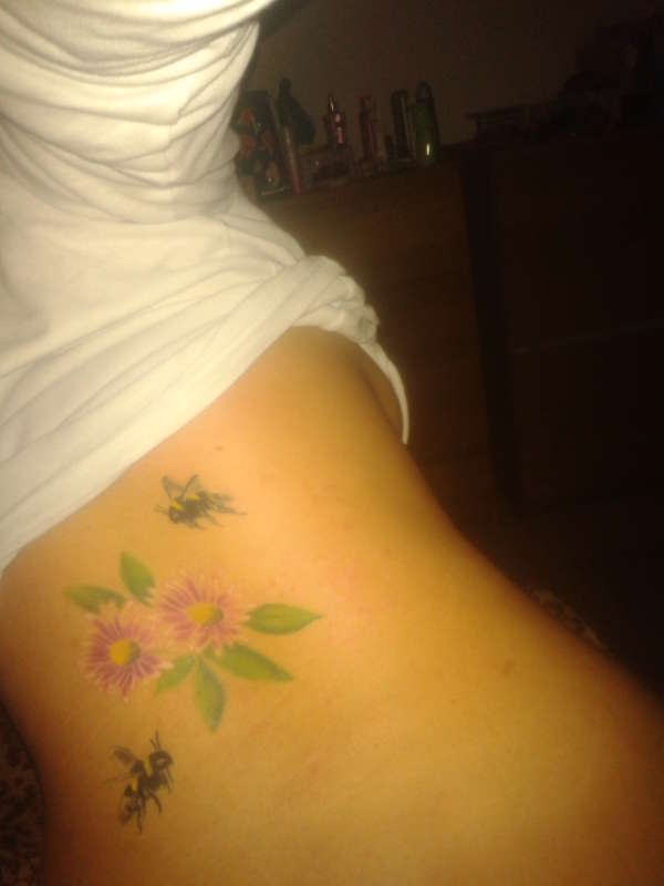 bees and flowers back piece tattoo