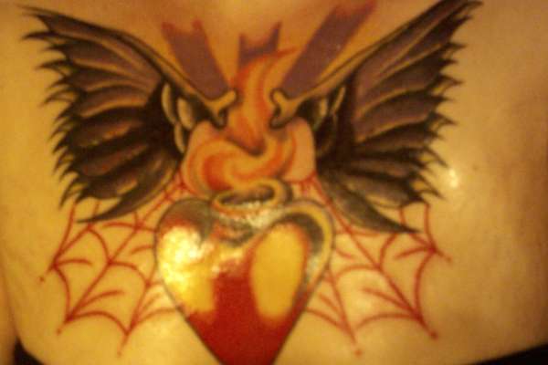 touched up chest piece tattoo