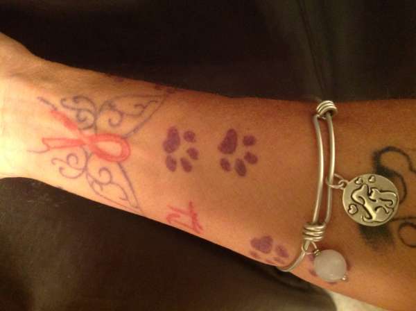 Animal paw prints tattoo