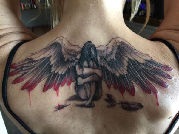 fallen angel wings tattoo chest