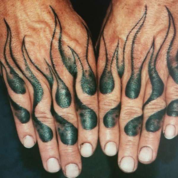 flaming hands tattoo by Steve'O tattoo