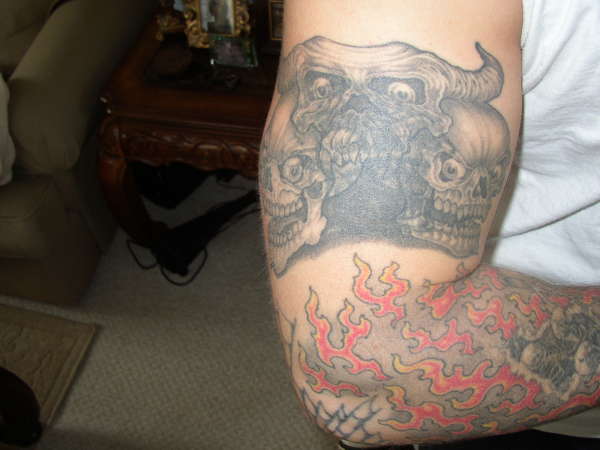 Skulls cover up tattoo