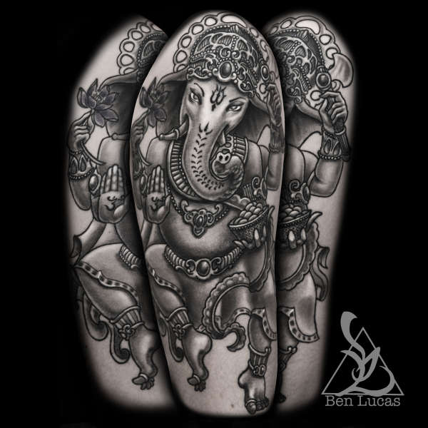 Black and Grey Ganesha half sleeve tattoo on upper arm. Done by tattoo