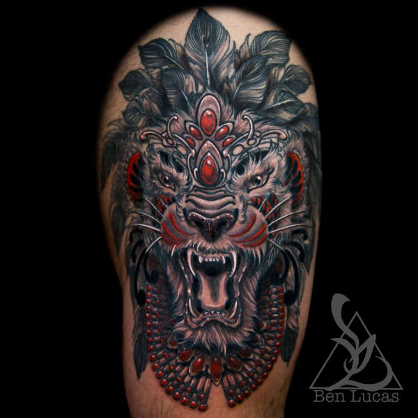 Erwins-black-grey-and-red-tribal-lion-thigh-tattoo-done-by-ben-l tattoo