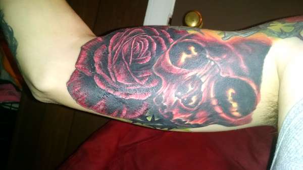Skull and rose cover up tattoo