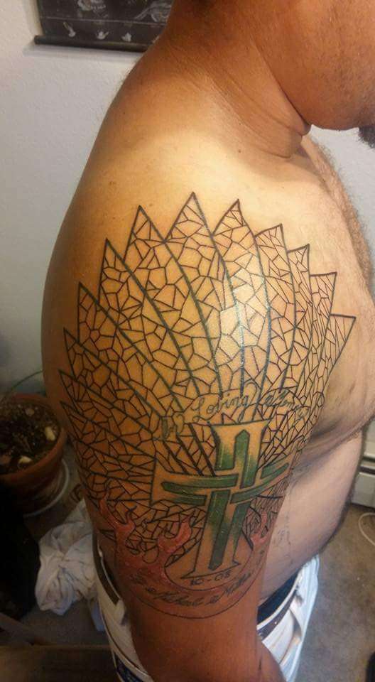 Stained glass over cross tattoo