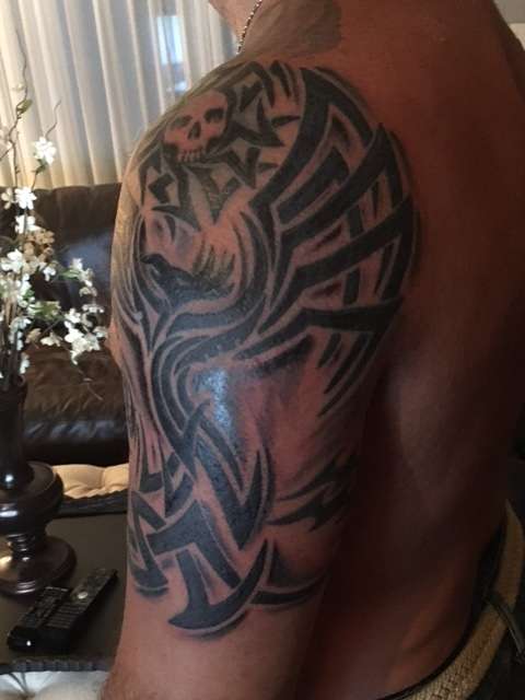Tribal half sleeve tattoo