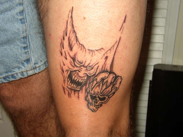 demon/skull tattoo