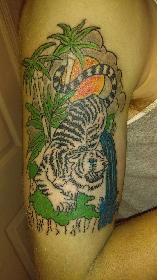white lion tattoo with trees and sun tattoo