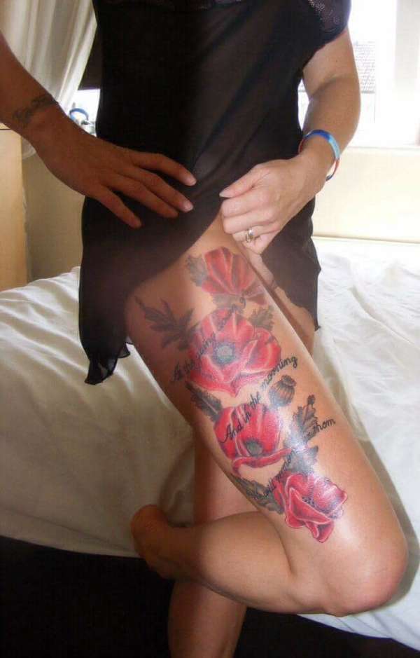 Poppies Remembrance themed thigh piece tattoo