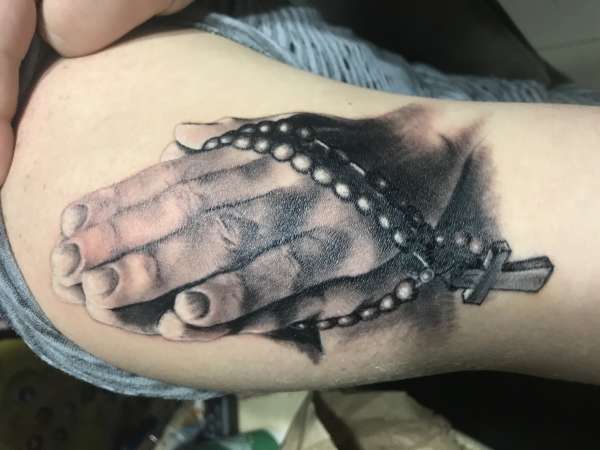 Praying hands tattoo