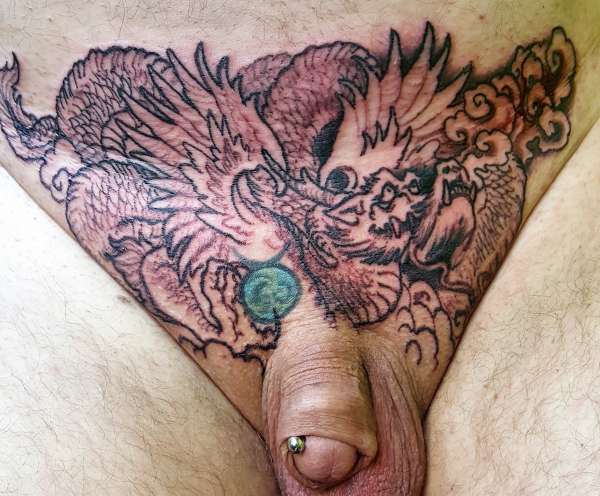 Start of pubic dragon tattoo.