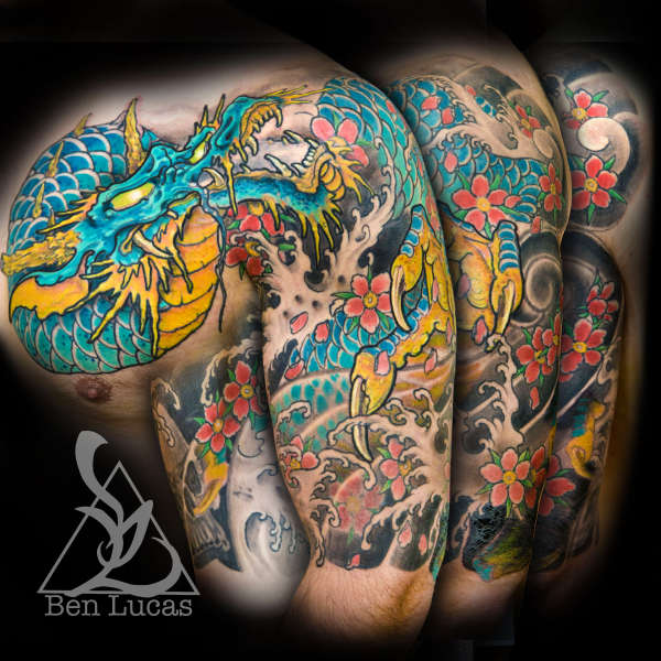Tyler's blue dragon and cherry blossoms half sleeve onto chest t tattoo