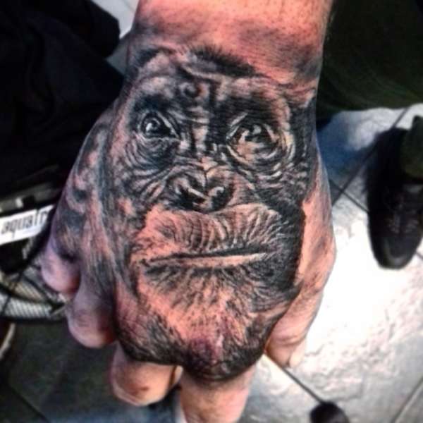 monkey hand piece tattoo