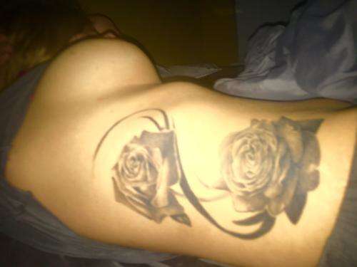 All black rose tattoo