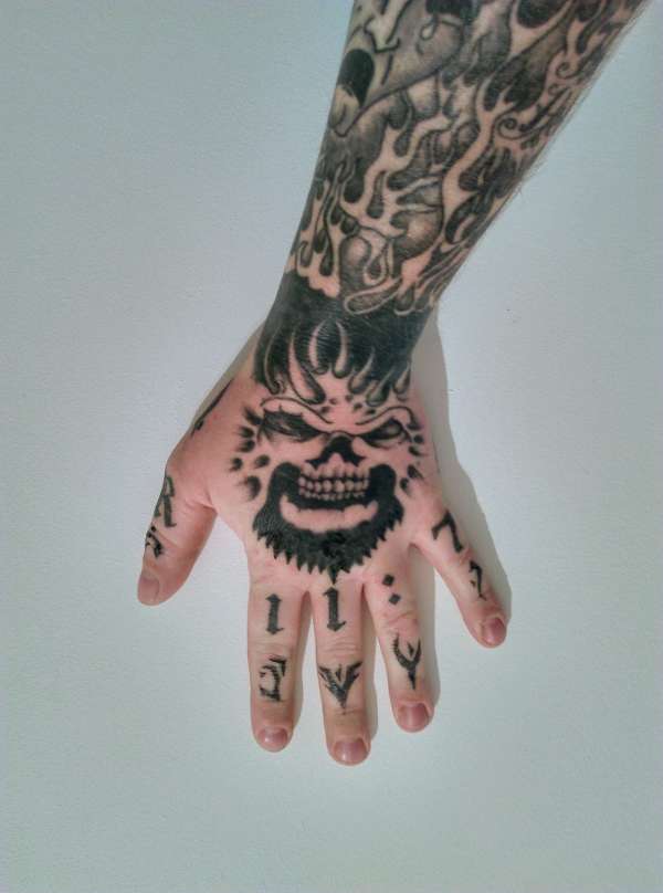 Demon hand tattoo