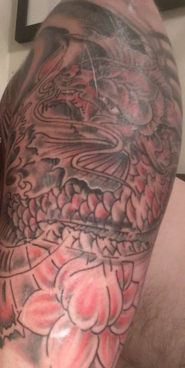 Koi dragon and lotus tattoo