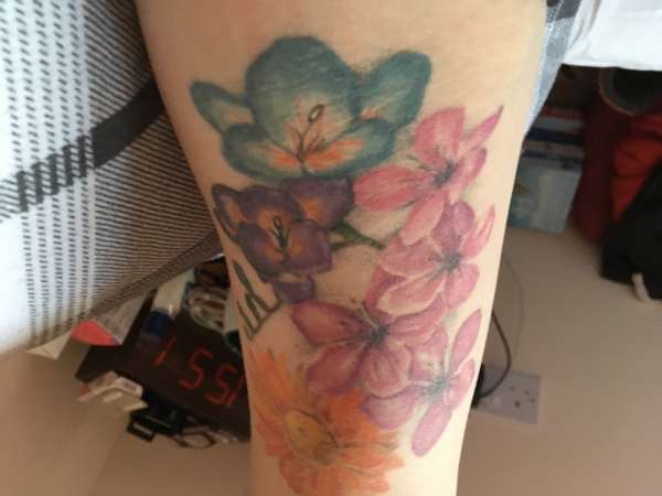 Mixed flowers tattoo