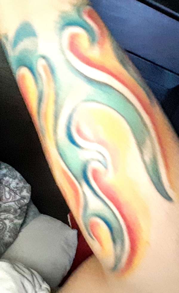 Flames left forearm tattoo