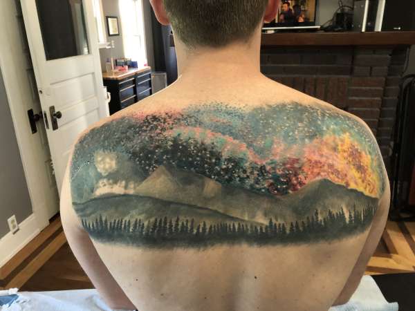 Mountain and galaxy tattoo