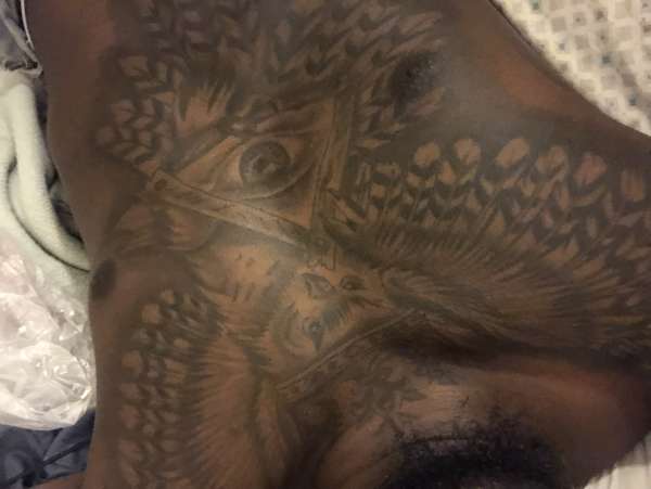 Owl holding all seeing eye. tattoo