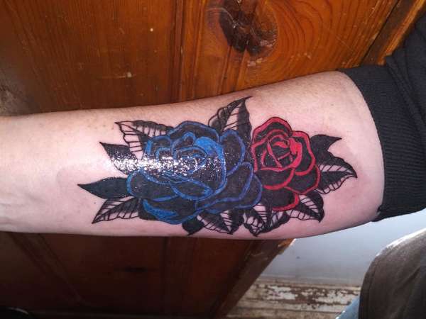 COVER UP OLD NAME TAT WITH ROSES tattoo