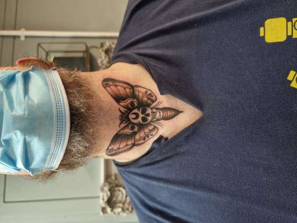 Death moth tattoo