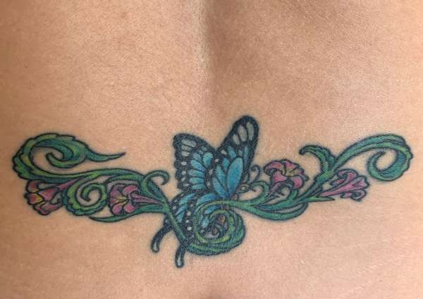 Lower back butterfly/floral tattoo