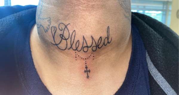 blessed on neck tattoo