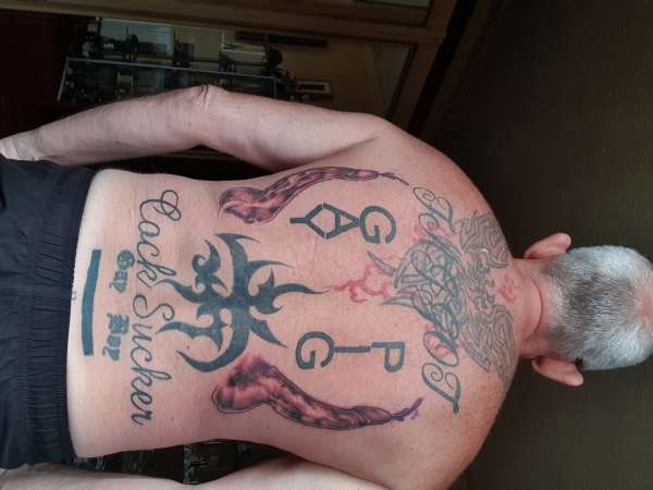 Cock and Balls tattoo on back tattoo